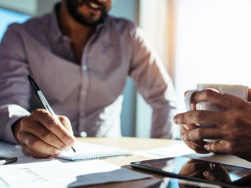 Business people sitting at table planning
