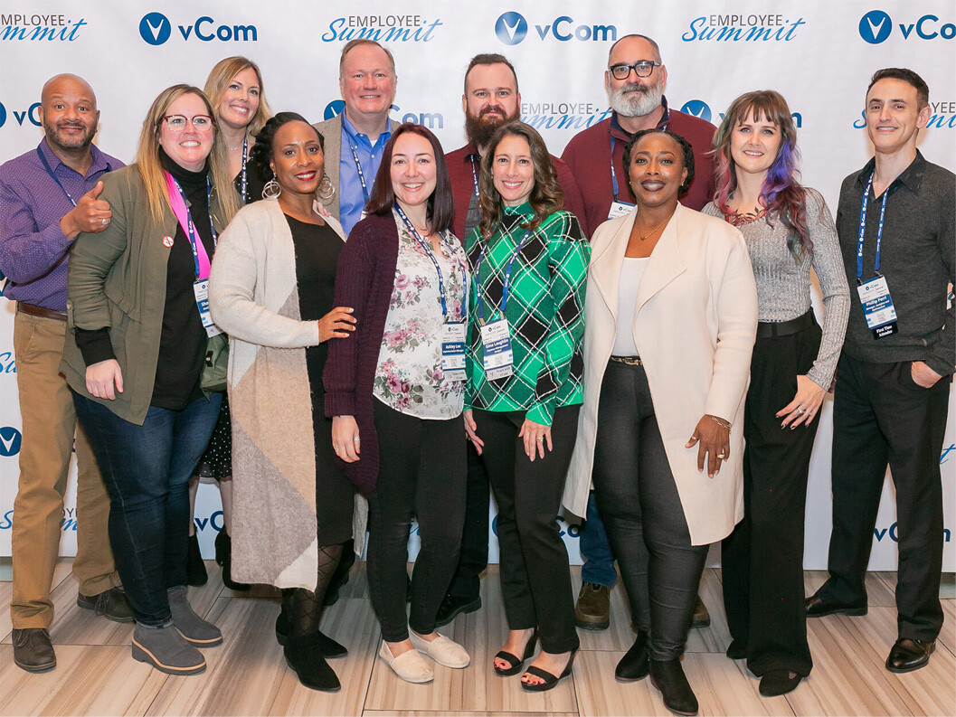 A photo of the vCom team