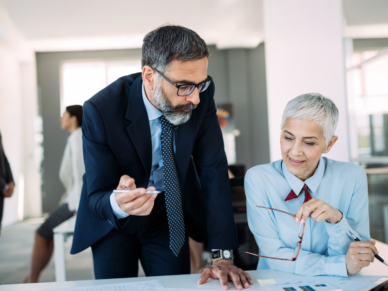 2 lawyers talking at a desk