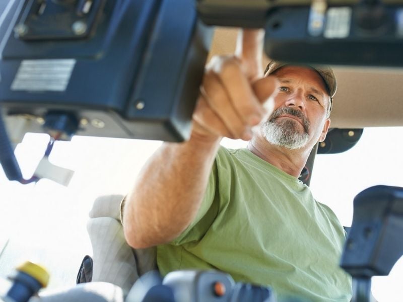 A machine operator in the field