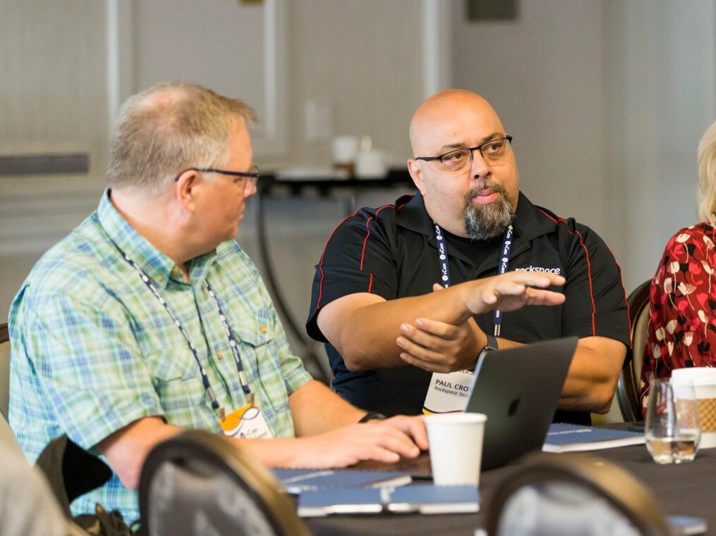 Customers talking at Customer Summit