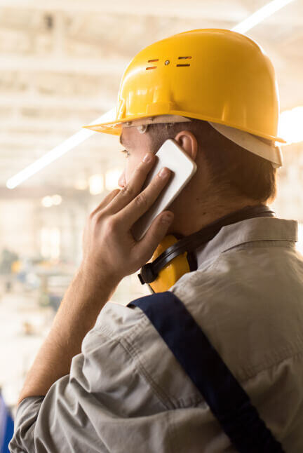 man-on-phone-in-hard-hat