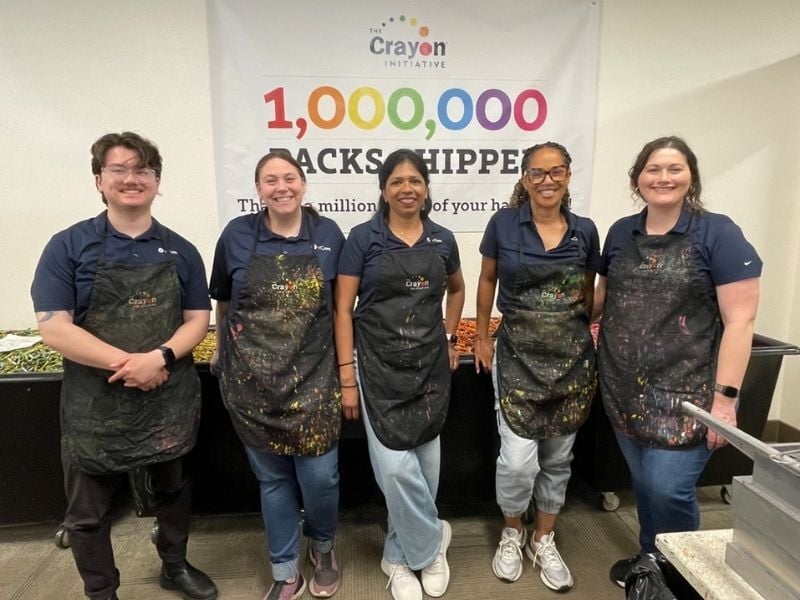 vCom employees volunteering at Crayon Initiative