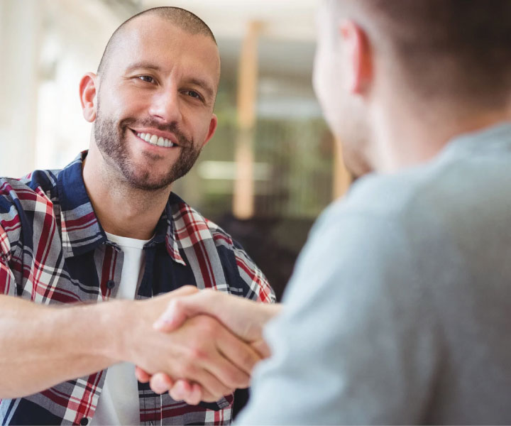 Customer-Referral-man-smiling-and-shaking-hands